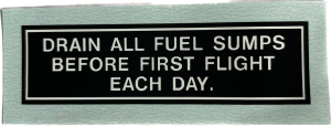 Naklejka "Drain All Fuel Sumps"
